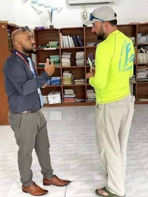 Friendly Maldives representative in discussion with local partner in a Maldivian office
