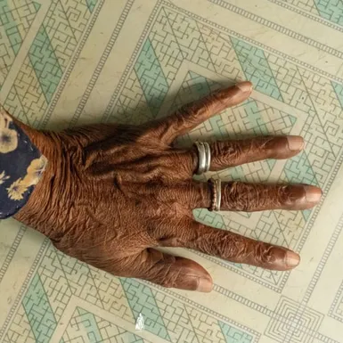 Elderly hand over traditional Maldivian script – Thaana alphabet with 24 letters