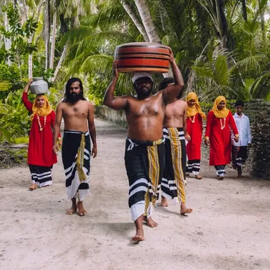 Traditional Maldivian procession with men and women – preserving cultural heritage and Thaana script